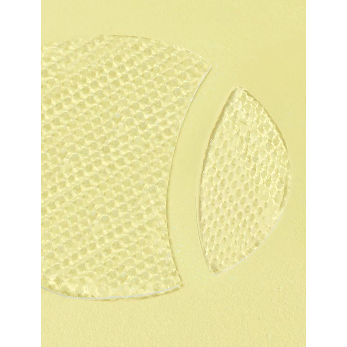 A plastic disc featuring a central hole, representing a component of the Advanced Snail Hydrogel Eye Patch.
